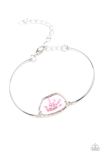 Encased inside an asymmetrical glass casing, a dainty pink firework flower centerpiece attaches to two arcing silver bars around the wrist for a whimsical floral look. Features an adjustable clasp closure.  Sold as one individual bracelet.