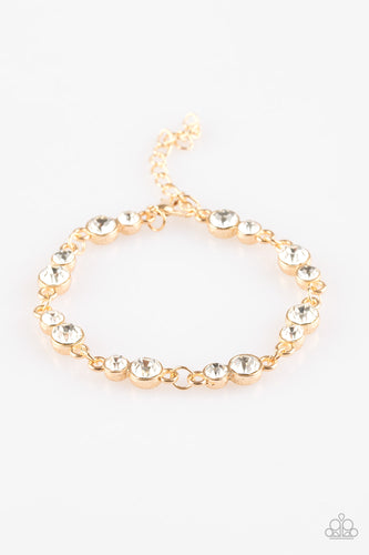 Varying in size, pairs of glassy white rhinestones are encrusted along glistening gold frames and linked around the wrist for a timeless finish. Features an adjustable clasp closure.