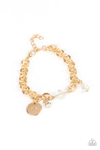 Load image into Gallery viewer, White crystal-like beads, a dainty white rhinestone, and a gold disc stamped in the word, &quot;love,&quot; adorn a double-linked gold chain, creating a flirty fringe around the wrist. Features an adjustable clasp closure.  Sold as one individual bracelet.
