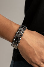 Load image into Gallery viewer, Glistening gunmetal disc fittings and pairs of classic gunmetal beads are threaded along stretchy bands around the wrist that connect into a bold industrial display around the wrist.  Sold as one individual bracelet.
