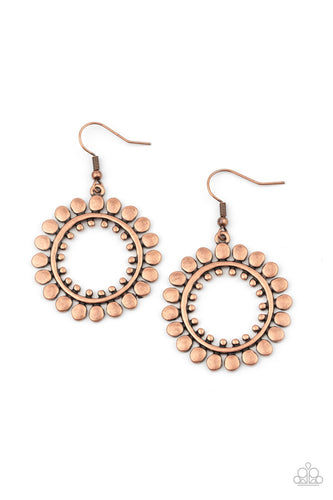 Asymmetrical copper discs flare out from an antiqued copper ring featuring an airy copper studded center, creating a radiant hoop. Earring attaches to a standard fishhook fitting.  Sold as one pair of earrings.