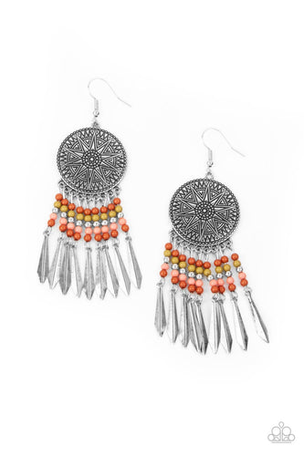 Rust, Brunt Coral, green, and silver beaded tassels swing from the bottom of an oversized silver disc embossed in an antiqued sunburst. Flared silver bars attach to the bottoms of the beaded tassels, creating an edgy fringe. Earring attaches to a standard fishhook fitting.