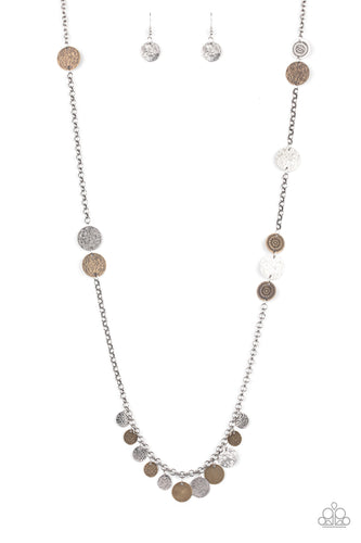 Floral stamped and scratched brass and silver discs trickle along a lengthened silver chain. Hammered and scratched discs dangle from the bottom, creating a noisy fringe. Features an adjustable clasp closure.