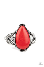 Load image into Gallery viewer, Encased in a silver rope-like frame, an oversized red teardrop stone is pressed into the center of an airy silver cuff abloom with leafy floral designs.
