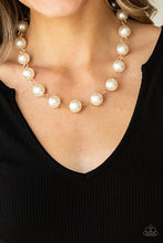 Load image into Gallery viewer, Textured gold rings and oversized white pearls delicately link into a bubbly statement piece below the collar. Features an adjustable clasp closure.  Sold as one individual necklace. Includes one pair of matching earrings.
