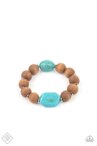 Oversized brown wooden beads and mismatched turquoise stone accents are separated by dainty silver discs and threaded along a stretchy band, creating an earthy centerpiece around the wrist.  Sold as one individual bracelet.  New Kit Fashion Fix