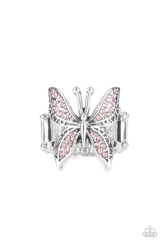 Glittery sections of pink rhinestones delicately encrust the decorative wings of a silver butterfly, creating a whimsically fluttering centerpiece atop the finger. Features a stretchy band for a flexible fit.  Sold as one individual ring.