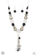 Load image into Gallery viewer, Smooth beads with a marbleized black and white swirl alternate with milky white and silver accents. A tassel of chains in various lengths is decorated with black, silver, and frosty pieces. Features an adjustable clasp closure.  Sold as one individual necklace. Includes one pair of matching earrings.   Get The Complete Look! Bracelet: &quot;Lights! Camera! Action!&quot; (Sold Separately)
