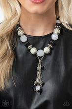 Load image into Gallery viewer, Smooth beads with a marbleized black and white swirl alternate with milky white and silver accents. A tassel of chains in various lengths is decorated with black, silver, and frosty pieces. Features an adjustable clasp closure.  Sold as one individual necklace. Includes one pair of matching earrings.   Get The Complete Look! Bracelet: &quot;Lights! Camera! Action!&quot; (Sold Separately)
