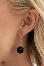 Load image into Gallery viewer, Smooth beads with a marbleized black and white swirl alternate with milky white and silver accents. A tassel of chains in various lengths is decorated with black, silver, and frosty pieces. Features an adjustable clasp closure.  Sold as one individual necklace. Includes one pair of matching earrings.   Get The Complete Look! Bracelet: &quot;Lights! Camera! Action!&quot; (Sold Separately)

