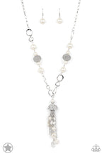 Load image into Gallery viewer, A half-shell studded in rhinestones overhangs a cluster of ivory pearls, tassels of silver chain, and small crystals. Two large wire mesh spheres and larger ivory pearls decorate the neckline.  Sold as one individual necklace. Includes one pair of matching earrings.
