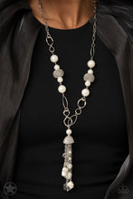 Load image into Gallery viewer, A half-shell studded in rhinestones overhangs a cluster of ivory pearls, tassels of silver chain, and small crystals. Two large wire mesh spheres and larger ivory pearls decorate the neckline.  Sold as one individual necklace. Includes one pair of matching earrings.
