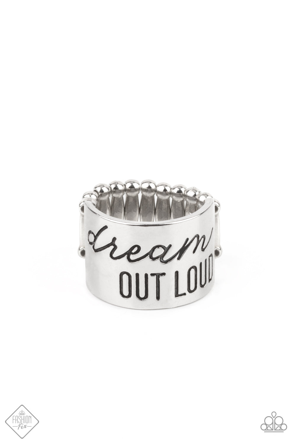The front of a thick silver band is stamped in the phrase, 