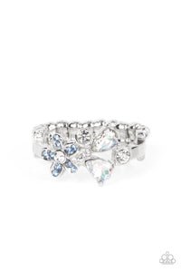 A blue rhinestone dotted floral frame joins round and teardrop white rhinestones atop a dainty silver band, blooming into an enchanting centerpiece across the finger. Features a dainty stretchy band for a flexible fit.  Sold as one individual ring.