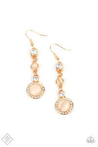 A glassy white rhinestone and champagne cat’s eye stone give way to a combination of two whimsy frames encircled in a ring of dainty white rhinestones, creating an elegant lure. Earring attaches to a standard fishhook fitting.  Sold as one pair of earrings.  New Kit Fashion Fix