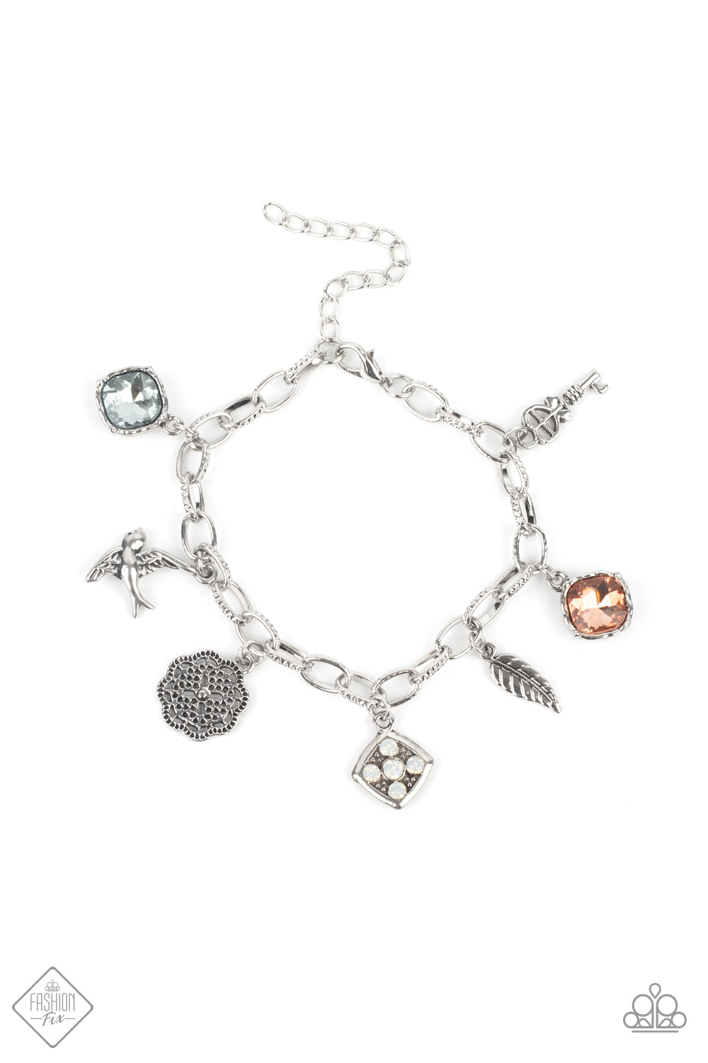 Multicolored gems, a floral medallion, a bird in flight, and a fluttering feather coalesce into a whimsical charm bracelet as they dangle from a delicate silver chain around the wrist. Features an adjustable clasp closure.  Sold as one individual bracelet.  New Kit Fashion Fix