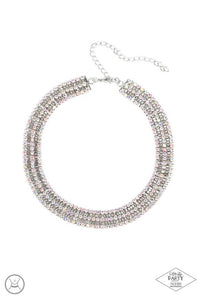 Featuring sleek square fittings, strands of glittery ethereal iridescence rhinestones connect with rows of silver box chain around the neck for a glittery twist. Features an adjustable clasp closure.  Sold as one individual choker necklace. Includes one pair of matching earrings.