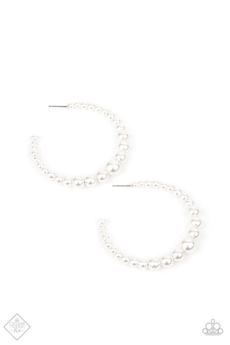 Gradually increasing in size at the center, a classy row of white pearls are threaded along an oversized hoop for a posh finish. Earring attaches to a standard post fitting. Hoop measures approximately 2 1/4