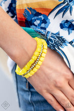 Load image into Gallery viewer, Infused with a strand of round and faceted silver beads, faceted rows of solid and opaque Illuminating cube beads are threaded along stretchy bands, wrapping around the wrist for an edgy pop of color.  Sold as one set of three bracelets.
