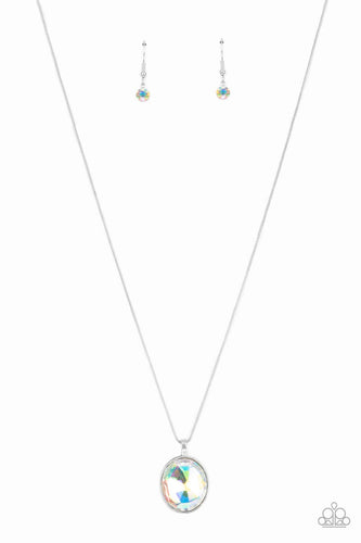 An oversized iridescent gem is pressed into the center of a sleek silver fitting, creating a mesmerizing statement piece at the bottom of a sleek silver chain. Features an adjustable clasp closure.  Sold as one individual necklace. Includes one pair of matching earrings.