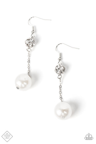 A lusciously oversized pearl is suspended from a dainty silver chain that delicately sways from a brilliant cluster of white rhinestones, making a glamorously elegant lure. Earring attaches to a standard fishhook fitting.  Sold as one pair of earrings.  New Kit Fashion Fix