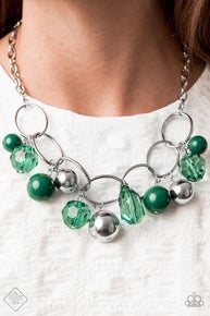 Infused with faceted Ultramarine Green crystal-like beads, a bubbly collection of oversized silver and Ultramarine Green beads swing from the bottom of an interconnected row of bold silver oval frames, creating a colorful fringe below the collar. Features an adjustable clasp closure