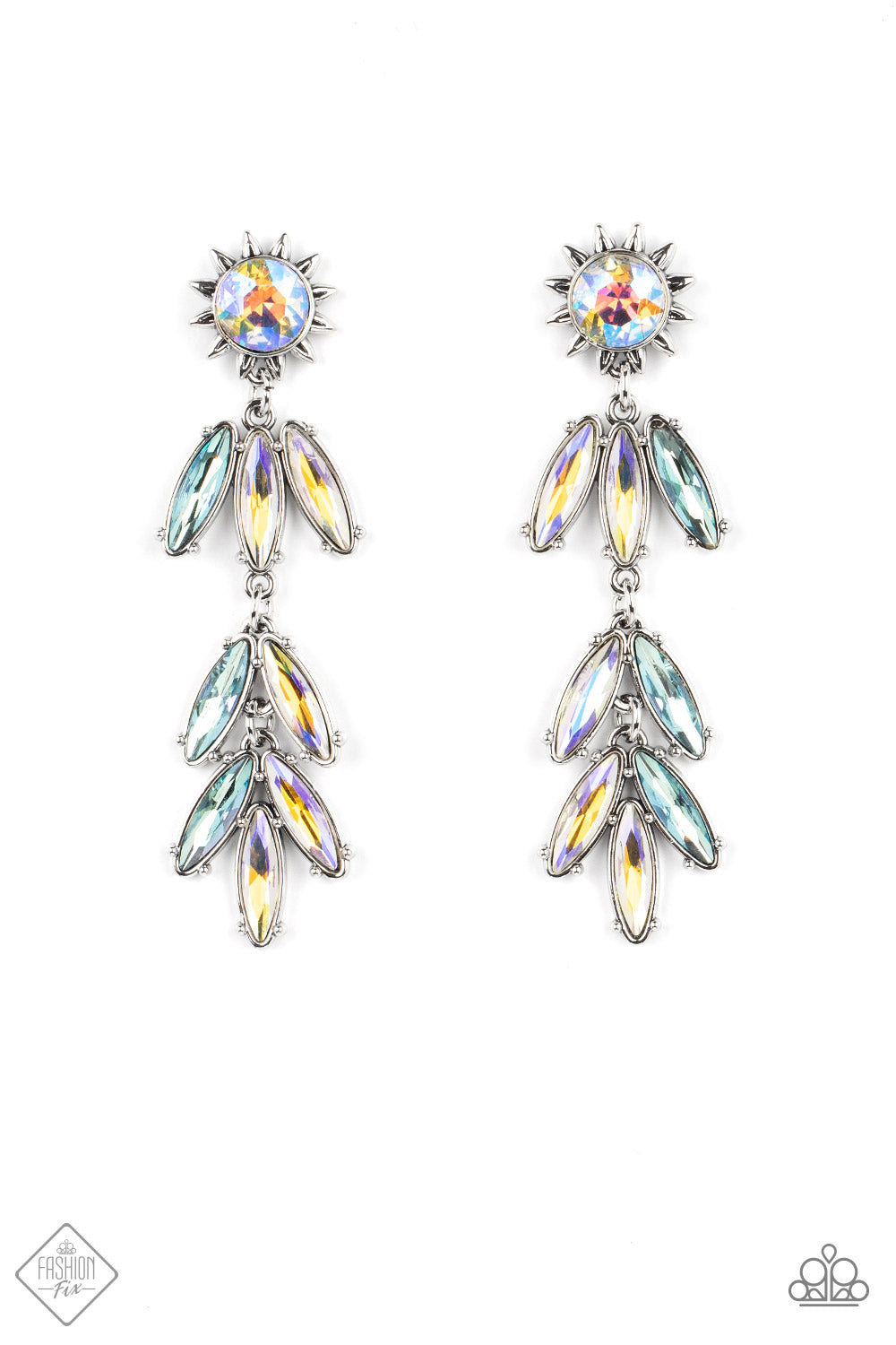 A silver sunburst frame wraps around an iridescent gem as it gives way to an explosion of marquise cut rhinestones in the same dreamy finish. The oblong frames swing dramatically from the ear, capturing and reflecting light at every turn. Earring attaches to a standard post fitting. Due to its prismatic palette, color may vary.  Sold as one pair of post earrings.  New Kit Double-Sided Post Fashion Fix
