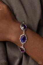 Load image into Gallery viewer, A row of brilliantly faceted gems is encased in layered antiqued silver frames. Featuring a metallic-like finish, the oval multicolored purple gems link end to end for an illustrious appeal around the wrist. Features an adjustable clasp closure.  Sold as one individual bracelet.
