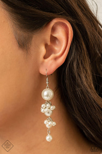 A set of classic pearls gradually decrease in size as they cascade from the ear. Clusters of dainty white pearls fall in between them, creating a timelessly tasseled display. Earring attaches to a standard fishhook fitting.  Sold as one pair of earrings.