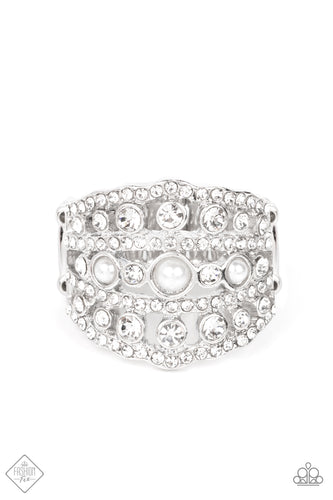 Layers of dainty silver bands, encrusted with sparkling white rhinestones, are accented with a trio of petite pearls on the centermost band. The stacked layers sweep across the finger, making an exquisite centerpiece. Features a stretchy band for a flexible fit.  Sold as one individual ring.  New Kit Fashion Fix