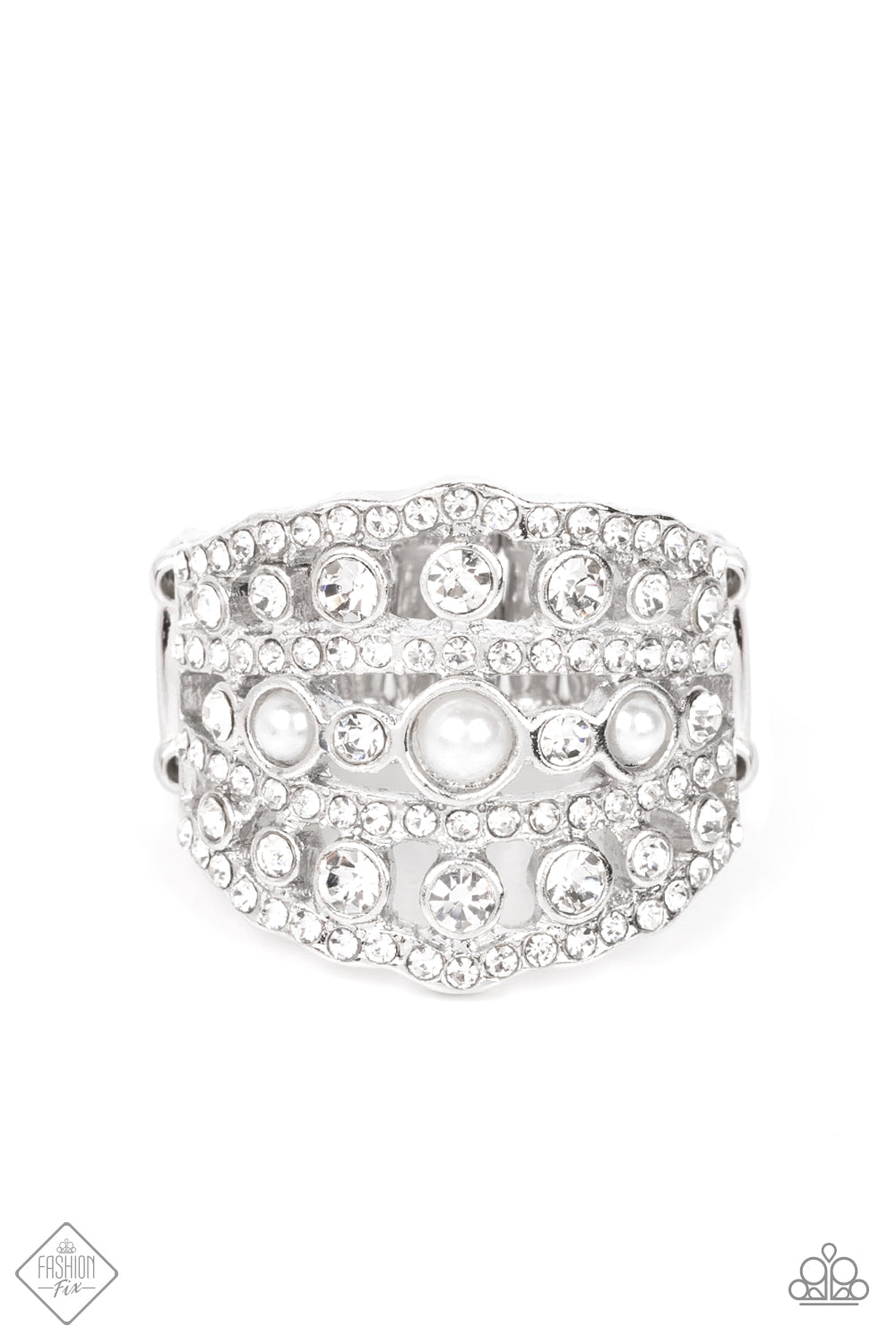 Layers of dainty silver bands, encrusted with sparkling white rhinestones, are accented with a trio of petite pearls on the centermost band. The stacked layers sweep across the finger, making an exquisite centerpiece. Features a stretchy band for a flexible fit.  Sold as one individual ring.  New Kit Fashion Fix