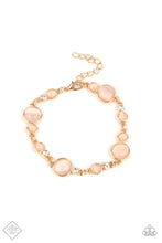 Load image into Gallery viewer, Encased in sleek gold fittings, a bubbly collection of champagne cat&#39;s eye stones and glassy white rhinestones coalesce into mismatched frames that delicately connect around the wrist for an effervescent elegance. Features an adjustable clasp closure.  Sold as one individual bracelet.  New Kit Fashion Fix
