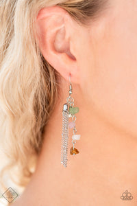 A hammered silver disc, silver chain tassel, and strand of raw cut multicolored rock beads delicately stream from the ear, creating an earthy fringe. Earring attaches to a standard fishhook fitting.  Sold as one pair of earrings.