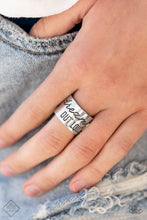 Load image into Gallery viewer, The front of a thick silver band is stamped in the phrase, &quot;Dream out loud,&quot; creating an inspirational centerpiece across the finger. Features a stretchy band for a flexible fit.  Sold as one individual ring.
