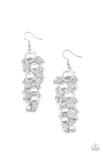 White pearls cascade down in varying sizes surrounded by dazzling white rhinestones for a blinding look. Earring attaches to a standard fishhook fitting.  Life of the Party Exclusive item, July 2022.  Sold as one pair of earrings.
