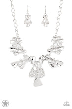 Load image into Gallery viewer, Twisted silver hourglasses dance along a chunky silver chain with tiny clear rhinestones adding sparkling, elegant accents. Beautiful textured pieces add depth to the design. Features an adjustable clasp closure.     Sold as one individual necklace. Includes one pair of matching earrings.
