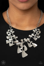 Load image into Gallery viewer, Twisted silver hourglasses dance along a chunky silver chain with tiny clear rhinestones adding sparkling, elegant accents. Beautiful textured pieces add depth to the design. Features an adjustable clasp closure.     Sold as one individual necklace. Includes one pair of matching earrings.
