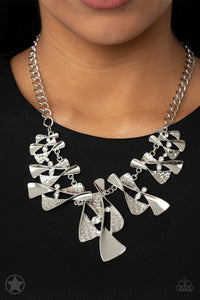 Twisted silver hourglasses dance along a chunky silver chain with tiny clear rhinestones adding sparkling, elegant accents. Beautiful textured pieces add depth to the design. Features an adjustable clasp closure.     Sold as one individual necklace. Includes one pair of matching earrings.