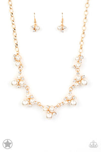 Clusters of pearls and dazzling white rhinestones join below the collar, creating refined frames. Infused with a glistening gold chain, the sections of luminescent frames trickle along the neck in a timeless fashion. Features an adjustable clasp closure.  Sold as one individual necklace. Includes one pair of matching earrings.