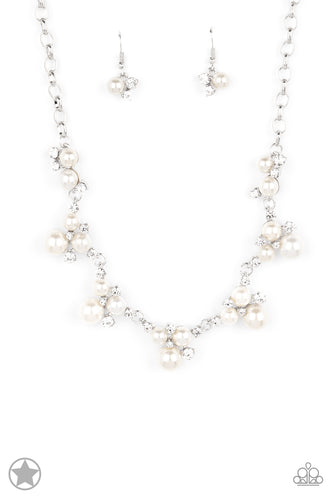 Clusters of pearls and dazzling white rhinestones join below the collar, creating refined frames. Infused with a glistening silver chain, the sections of luminescent frames trickle along the neck in a timeless fashion. Features an adjustable clasp closure.  Sold as one individual necklace. Includes one pair of matching earrings.