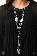 Load image into Gallery viewer, Long chain of black crystalized beads, curved plates of silver with a pearly finish, and chunky silver rings lead down to a tassel of chains and charms, including a crescent moon and a heart.     Sold as one individual necklace. Includes one pair of matching earrings.
