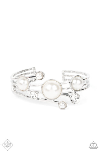 Luxuriously oversized pearl beads, encased in silver frames, mingle with brilliant white rhinestones, as they drift across silver bands that flare out on either side before wrapping into an airy cuff around the wrist.  Sold as one individual bracelet.  New Kit Fashion Fix