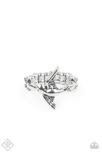 Caught in mid-flight, a graceful silver bird engraved with stunning detail flies over a silver band for a whimsical display atop the finger. Features a dainty stretchy band for a flexible fit.  Sold as one individual ring.  New Kit Fashion Fix