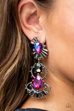 Load image into Gallery viewer, A cosmic collision of iridescent pink teardrop gems and a solitaire smoky emerald cut rhinestone haphazardly adorns studded silver frames. Dotted in round and emerald cut hematite rhinestone accents, the abstract frames stack into a stellar lure. Earring attaches to a standard post fitting. Due to its prismatic palette, color may vary.  Sold as one pair of post earrings.
