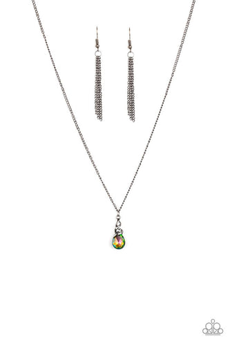 A shimmery gunmetal wire-like frame wraps around the top of a glittery rainbow teardrop gem, creating a timeless pendant below the collar.