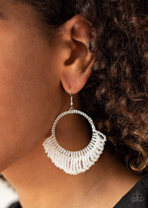 Rings of dainty iridescent seed beads cascade from the bottom of a matching beaded hoop, creating a dramatically colorful fringe. Earring attaches to a standard fishhook fitting.