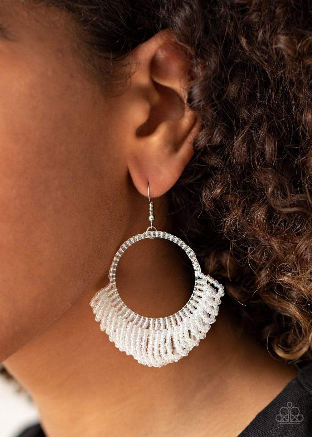 Rings of dainty iridescent seed beads cascade from the bottom of a matching beaded hoop, creating a dramatically colorful fringe. Earring attaches to a standard fishhook fitting.