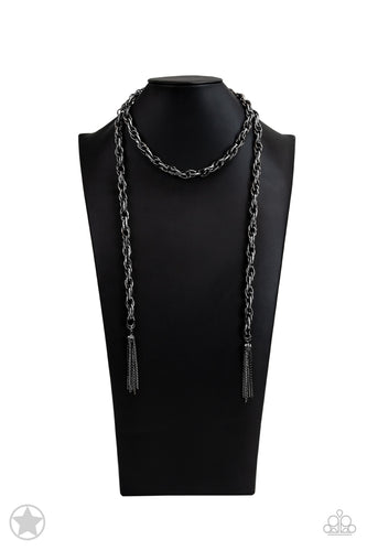 A single strand of spiraling, interlocking links with light-catching texture is anchored by two tassels of chain that add dramatic length to the piece. Undeniably the most versatile piece in Paparazzi's history, the scarf necklace features FIVE different ways to accessorize: Open Layer, Loop, Traditional Wrap, Double Knot, and Nautical Knot.  Sold as one individual necklace. Includes one pair of matching earrings. BlockbusterLogo