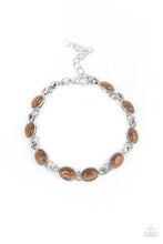 Load image into Gallery viewer, Featuring studded silver fittings, brown cat&#39;s eye stone frames delicately connect with ornate silver links around the wrist for an enchanted fashion. Features an adjustable clasp closure.  Sold as one individual bracelet.
