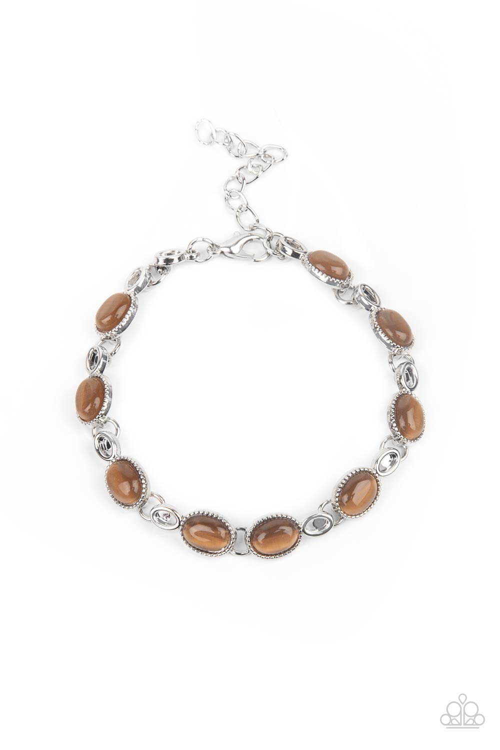 Featuring studded silver fittings, brown cat's eye stone frames delicately connect with ornate silver links around the wrist for an enchanted fashion. Features an adjustable clasp closure.  Sold as one individual bracelet.